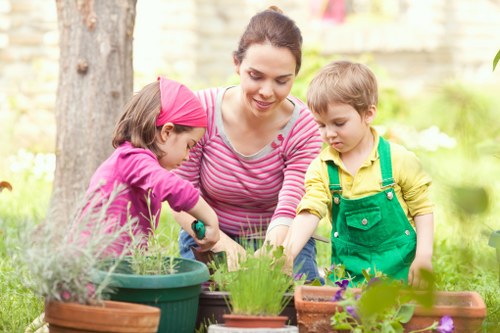 Professional gardener reviewing site safety
